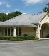 The front of the Boerne Dental Center building, with its arched stone entry.