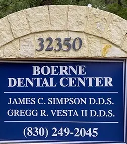 The stone monument sign: Boerne Dental Center, James C. Simpson D.D.S., Gregg R. Vesta II D.D.S., (830) 249-2045.